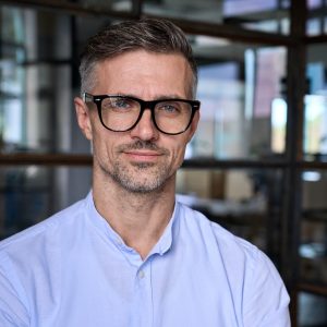 Mature businessman leader manager in office, headshot business portrait. Mature businessman leader manager in office, headshot business portrait.