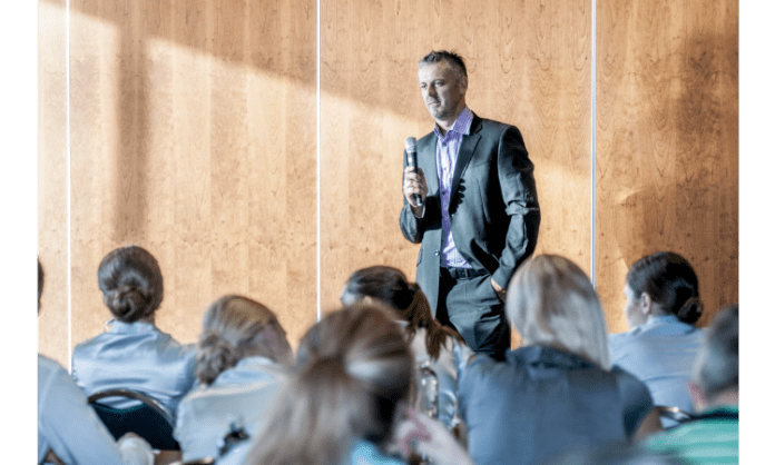 public speaker heading How to become a Confident and Effective better Public Speaker