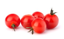 Small cherry tomato on white background close up