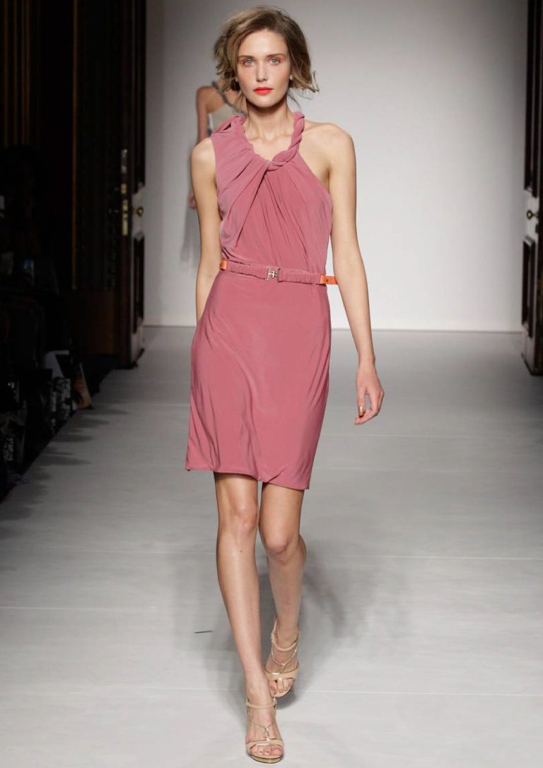 Photo of a female model on the catwalk wearing a dress at LFW
