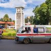 A van driving on the street, with people inside, symbolizing a small-business entrepreneur in Africa