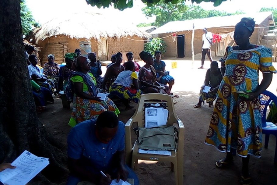 A group of women in a Togo village, having a workshop and signing contracts for small business
