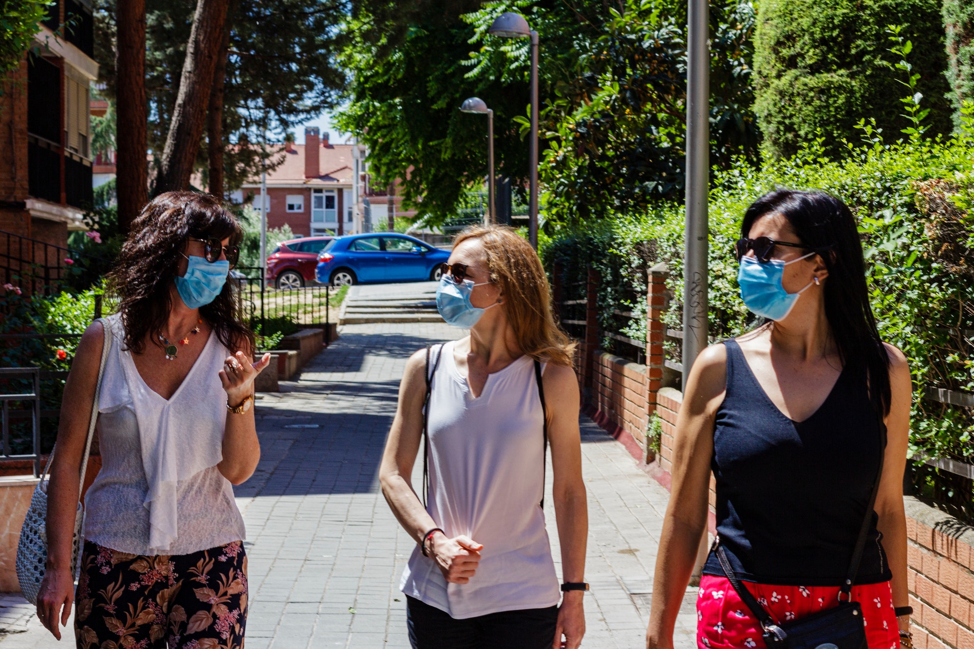 Three woman going for a walk wearing face mask in a new normal