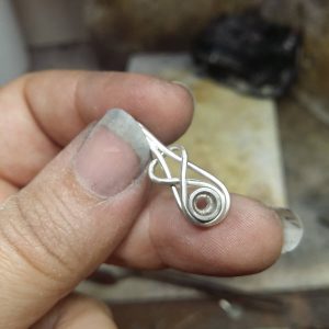 Silver knot pendant ready to solder together