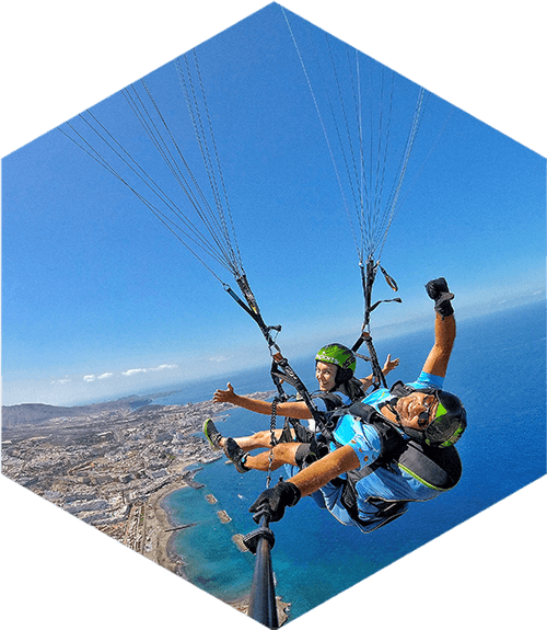 tandem paragliders over the sea