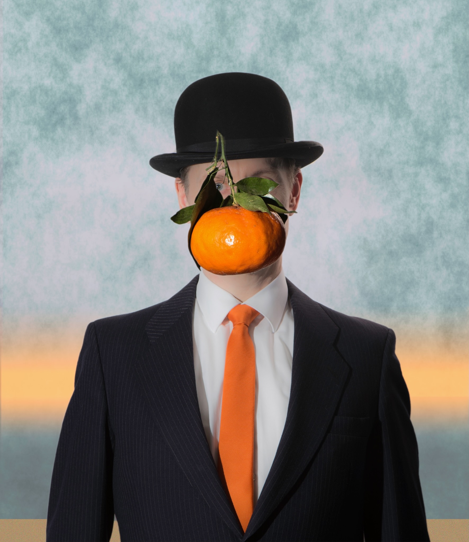 Recreation of the famous Magritte painting "The Son of Man", with an orange instead of an apple.