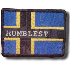 Blue patch with black and yellow cross, plus the word Humblest in white