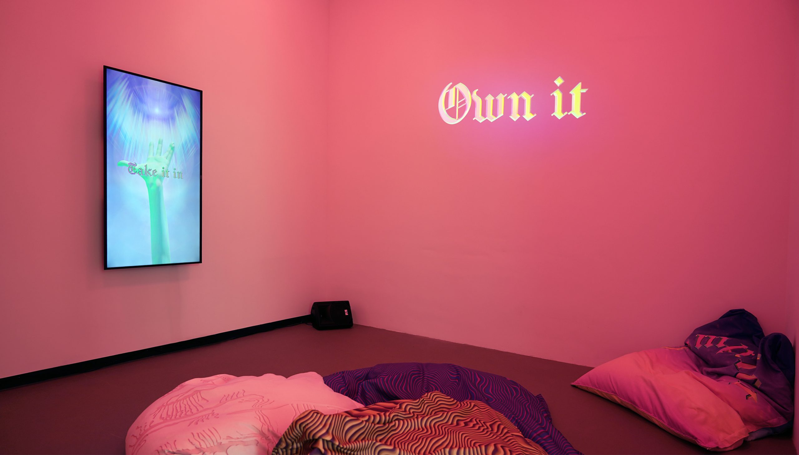Complicit, spatial installation with two videos and bean bags, healing room, pink light, alexandra crouwers