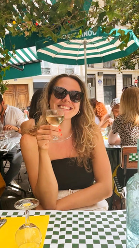 Amber having a glass of wine at Chez Janou