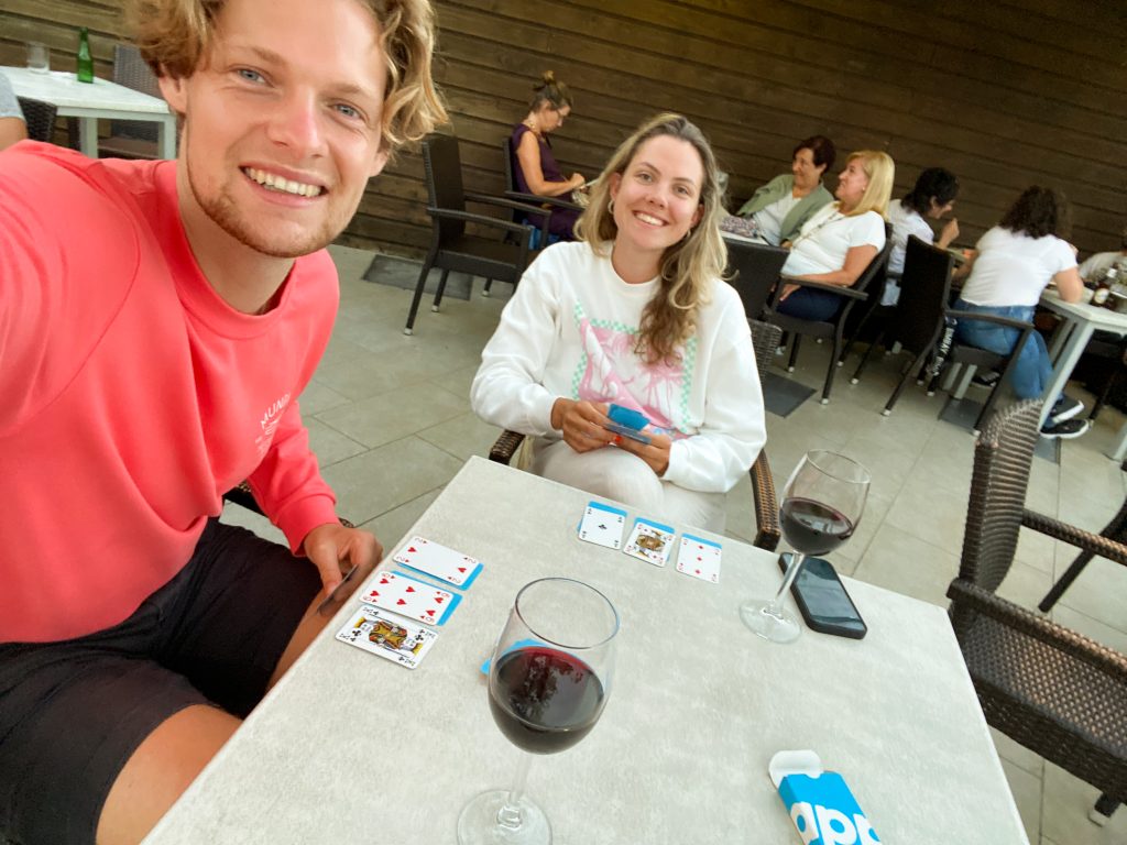 Wessel and Amber at the restaurant of Camping Portuondo with wine and cards, Mundaka, Spain