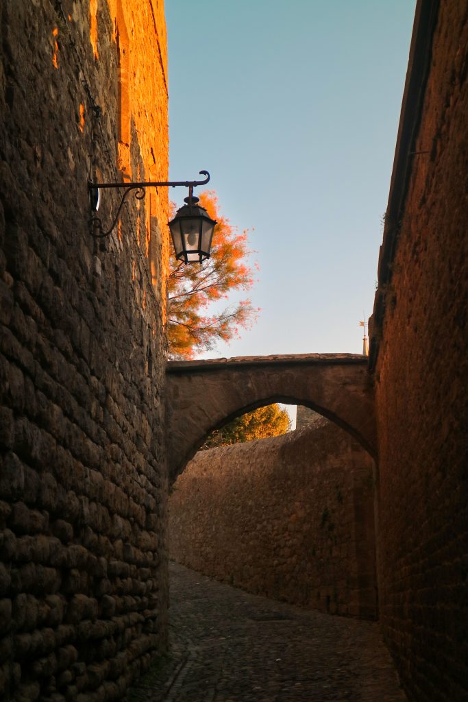 Gaslamp and alleyway in Carcassonne during sunset