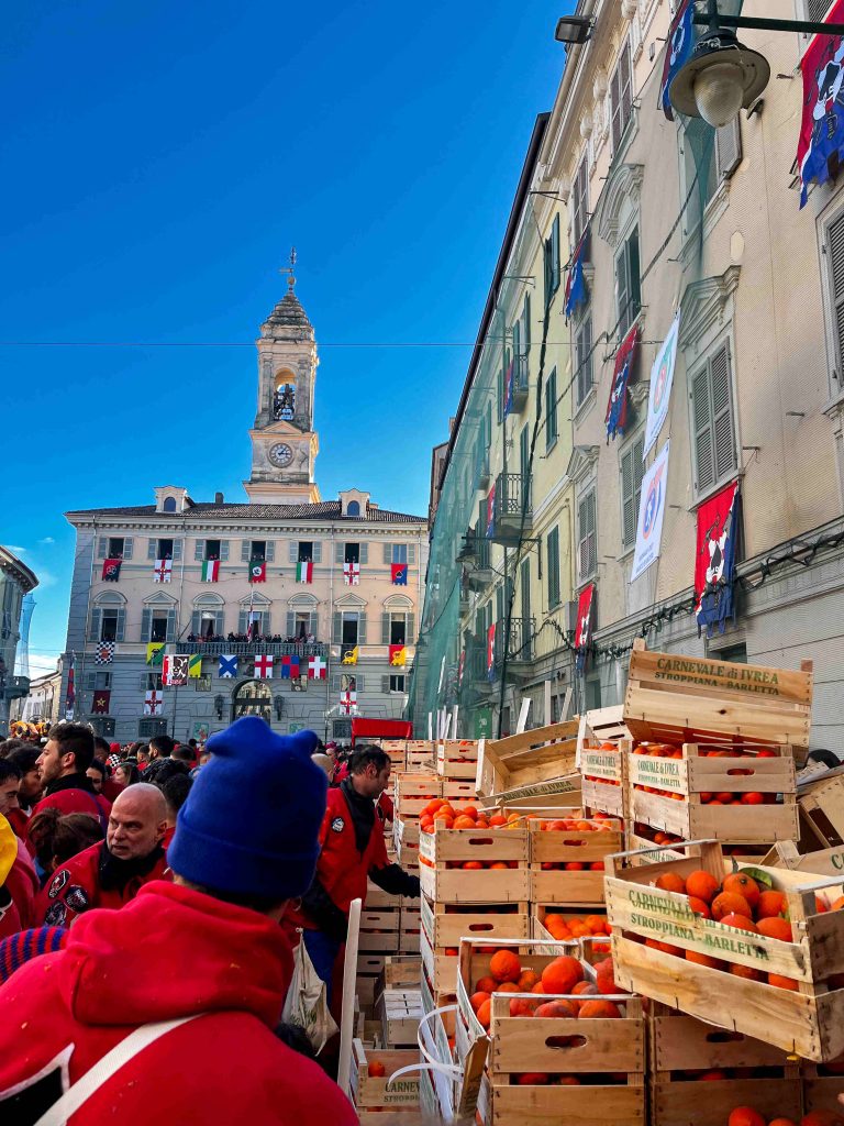 Crates of oranges at main town square at carnival in Ivrea