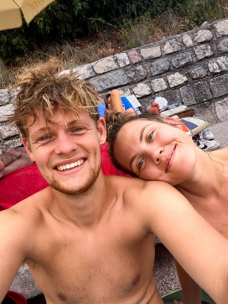 Wessel and Amber at the beach in Perast, Montenegro