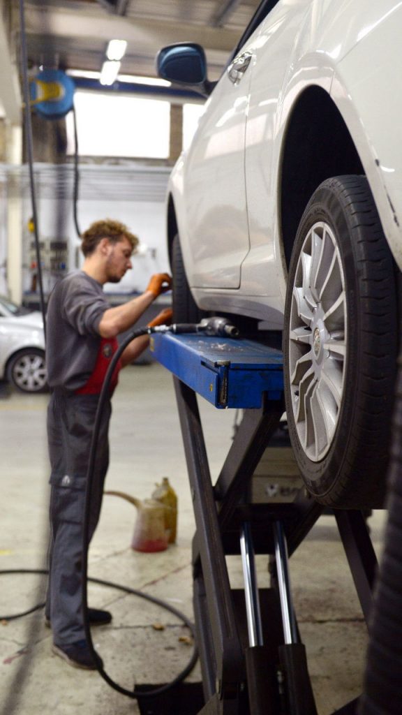 Mechanic working on car