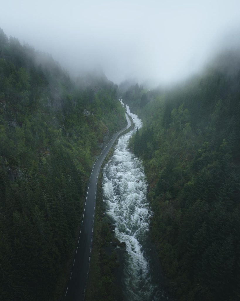 road and water stream between mountains Norway