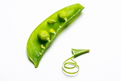 Green sugar snap pea on a white bac kground