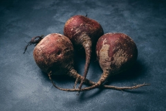 Red beets on blue-gray background