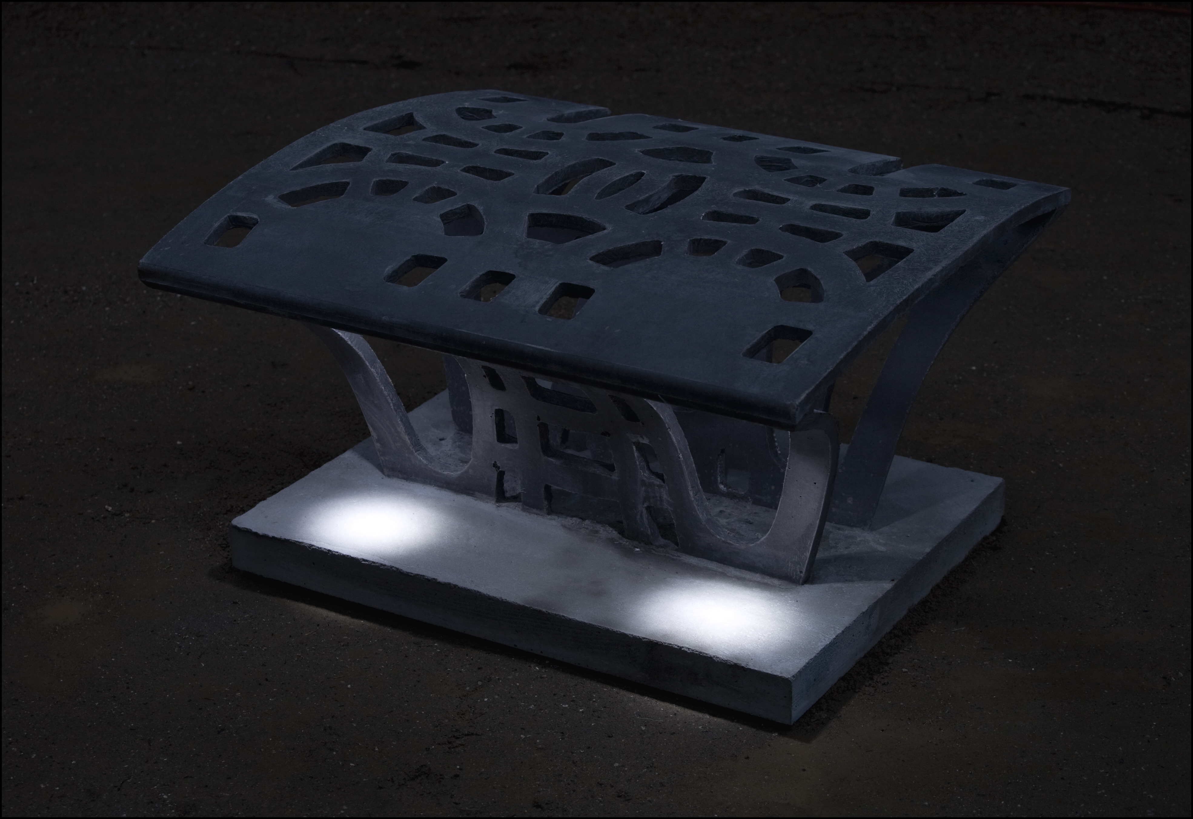 Prototype of multifunctional urban light furniture, crafted with CRC concrete and glazed surfaces, seamlessly integrating into the pavement. 14