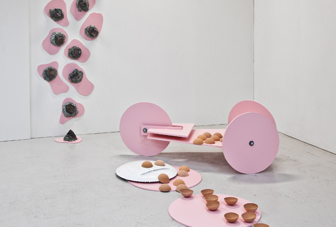 Ceramic installations inspired by childhood soapbox cars, exploring time, memory, and space at Gallery 21 in Malmö. 13