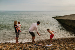 family by the beach in Hove, UK