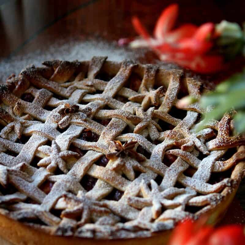 a pie sitting on top of a wooden cutting board