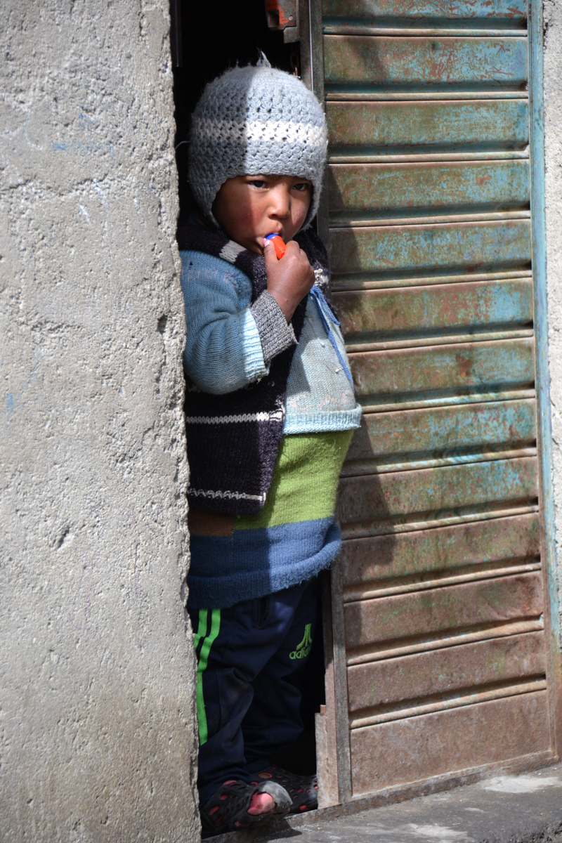 Bolivia – Boy in open door– 1200px