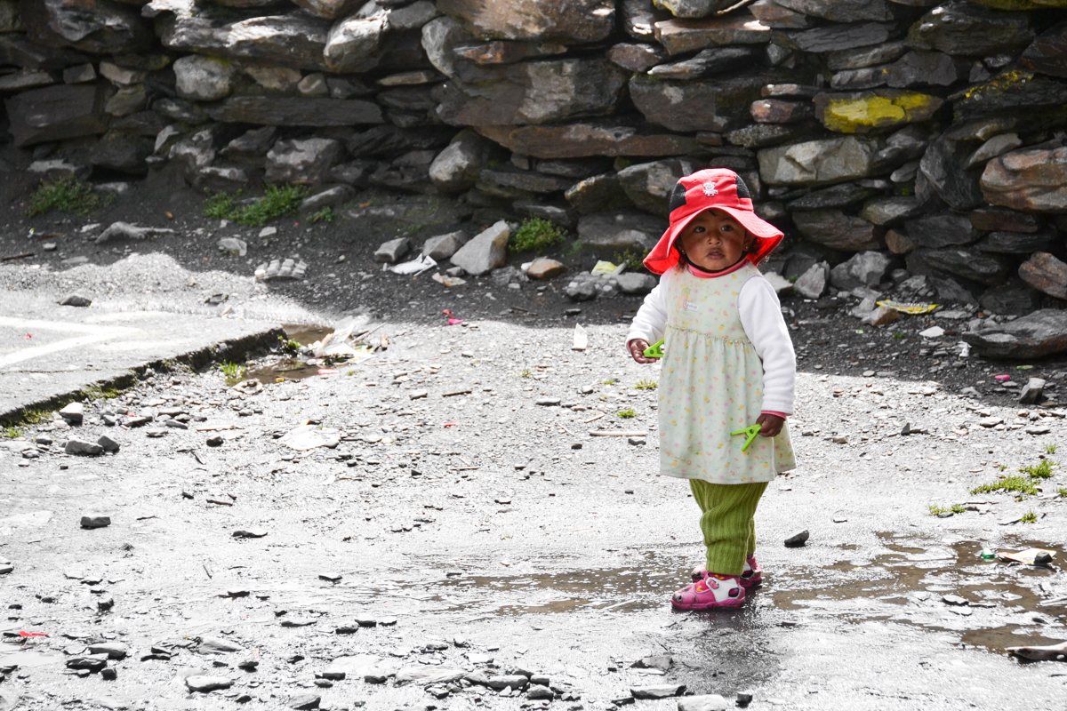 Bolivia – Girl with red hat in Agua Blanca– 1200px