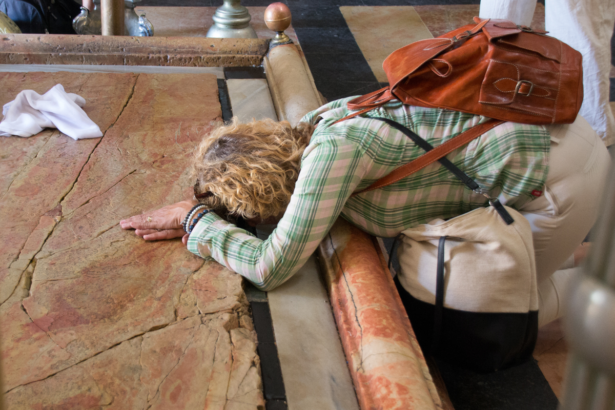 Israel – Praying woman in Church of holy sepulchre Jerusalem- 1200px