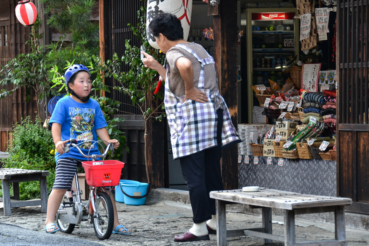 Japan – Woman warning boy on bike