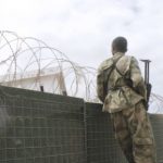 FILE: A Somali army soldier looks over a fence during an attack on the Somali parliament in Mogadishu, on 24 May, 2014. Picture: AFP.