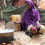 Somali young girl cooks food outside their makeshift home inside a refugee camp in Mogadishu, Somalia, Tuesday, Sept. 20, 2016. A new U.N. report says five million people, more than 40 percent of the population in Somalia, are not getting enough food, on the chaotic Horn of Africa. The report released Tuesday says the number of people who are food insecure has increased by 300,000 since February. (Farah Abdi Warsameh/Associated Press)