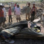 Yemenis inspect the damage in an area near the communications tower hit by Saudi airstrikes, in the port city of Hudaydah, on November 27, 2016. (Photo by AFP)
