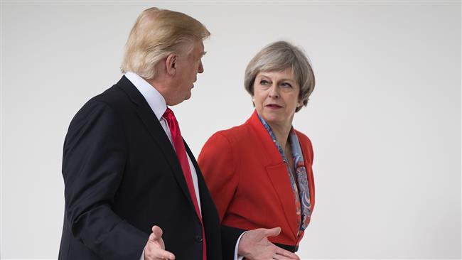 US President Donald Trump (L) and British Prime Minister Theresa May walk to a press conference at the White House, January 27, 2017 in Washington, DC. (Photo by AFP)