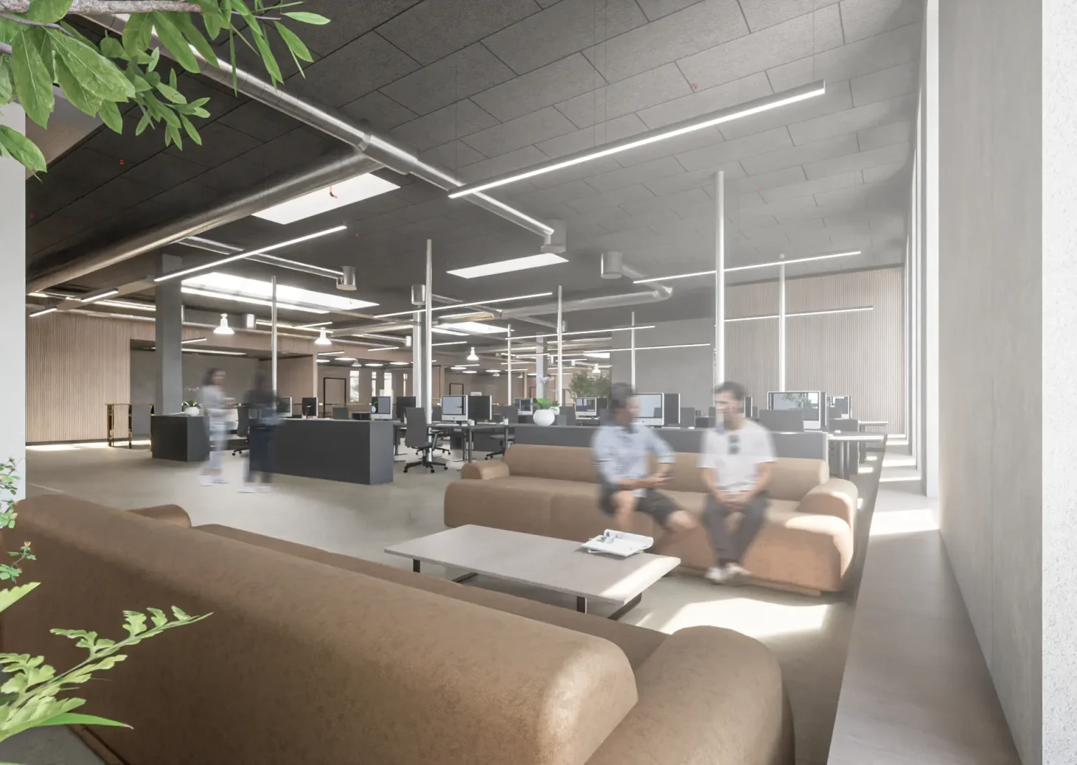 Loungeområde med sofaer og arbejdspladser i åbent kontorlandskab hos Coolshop