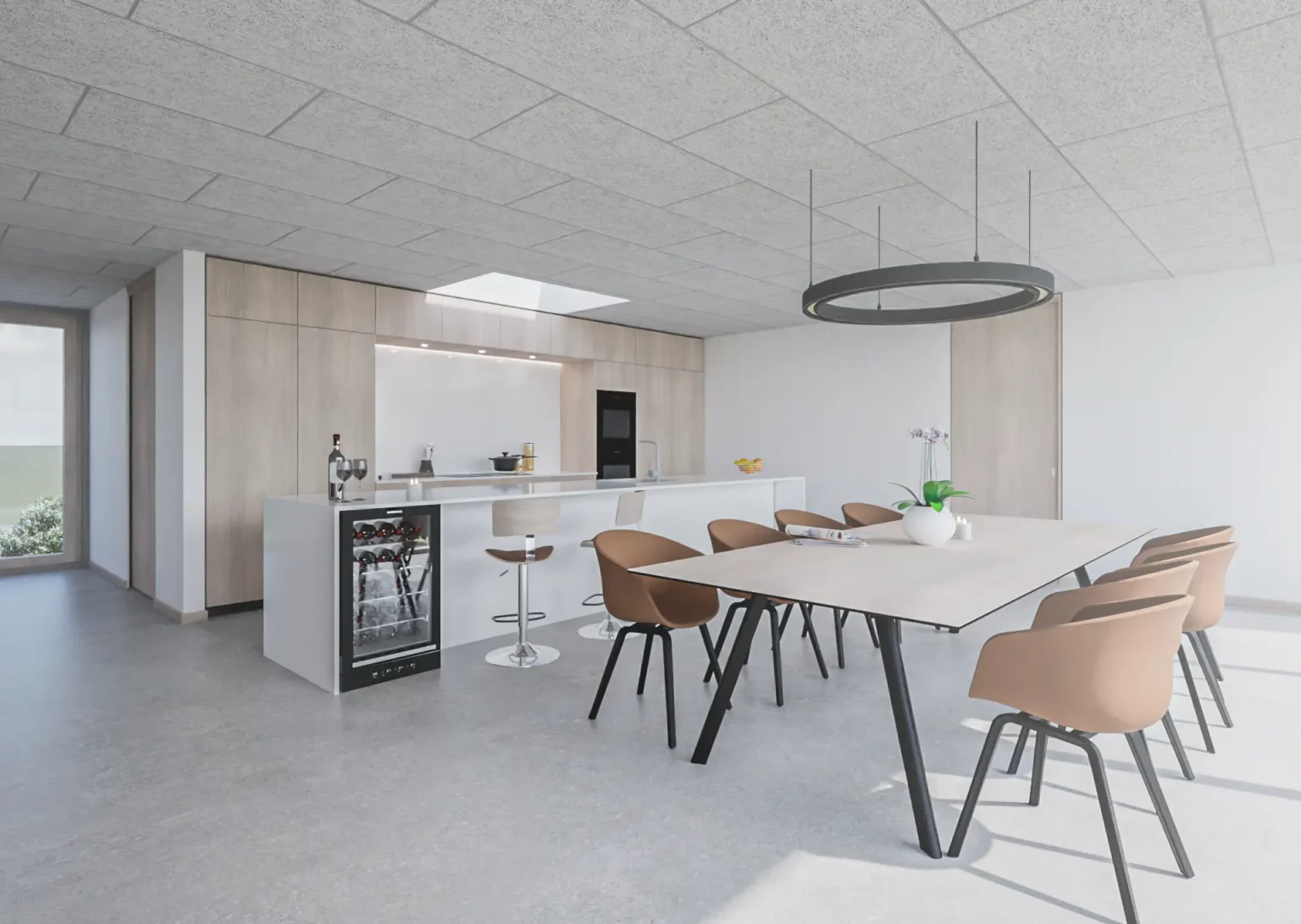 Køkken og spiseområde i åben planløsning med ovenlys og store glaspartier.