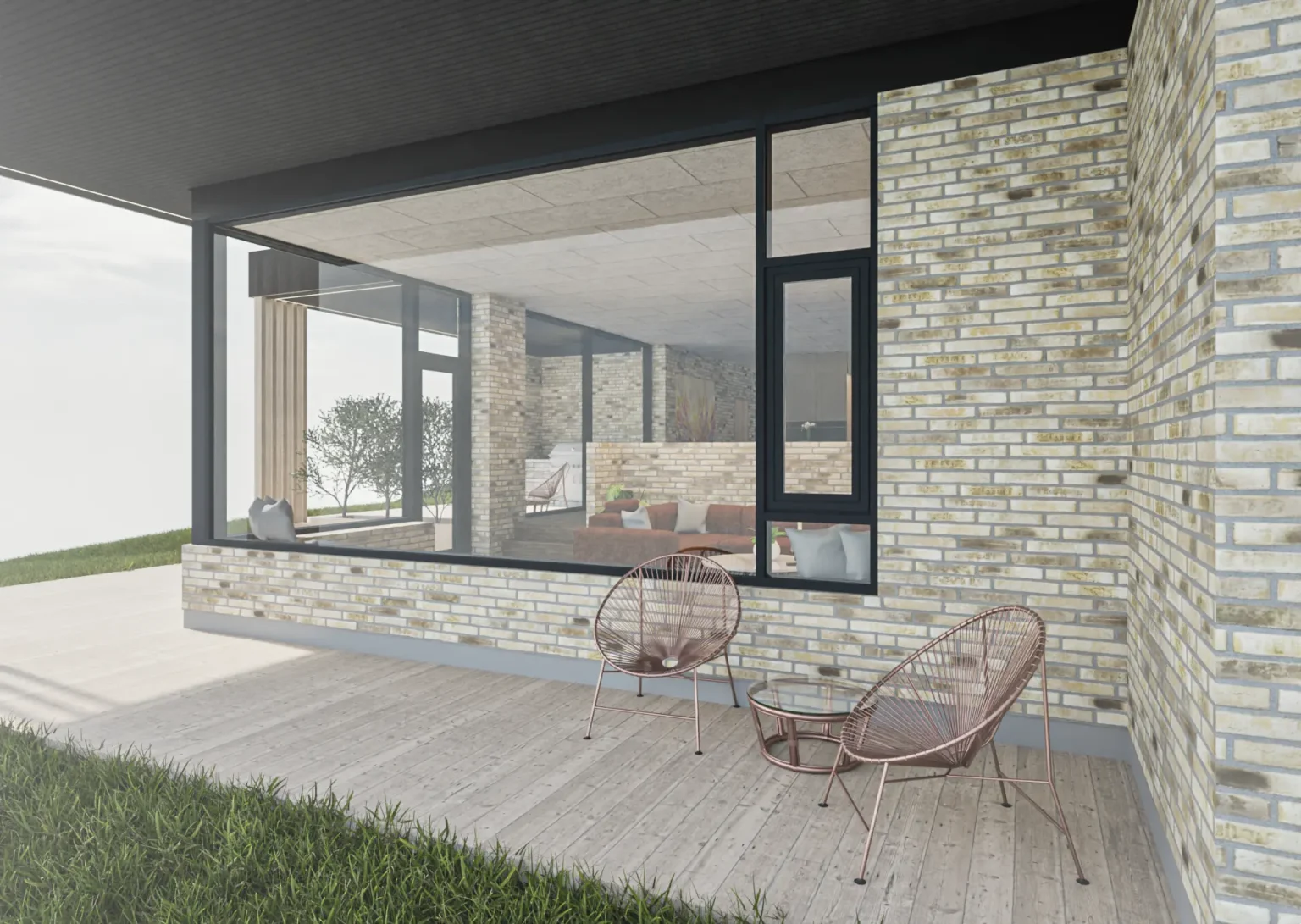 Overgang mellem stue og terrasse med store skydedøre og teglfacade.
