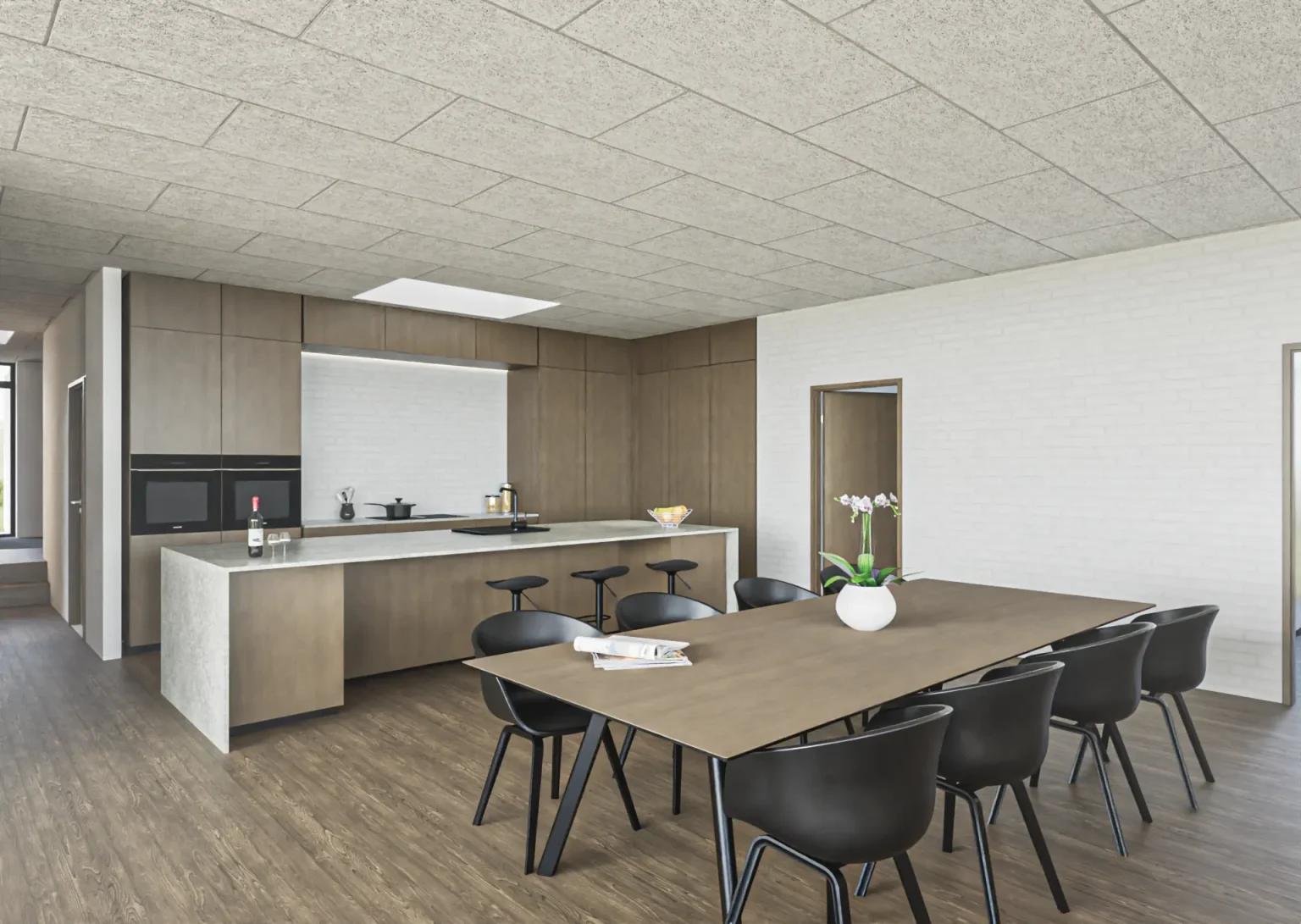 Spiseområde i Villa I38 med ovenlys og åben forbindelse til køkkenet.