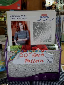 A box of knitting patterns labelled 50P each from box, in Art and Craft Valley