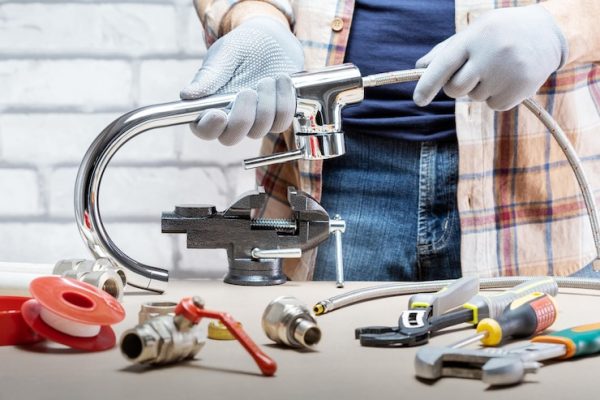 professional-plumber-with-water-tap-tools_106035-1719 professional-plumber-with-water-tap-tools_106035-1719