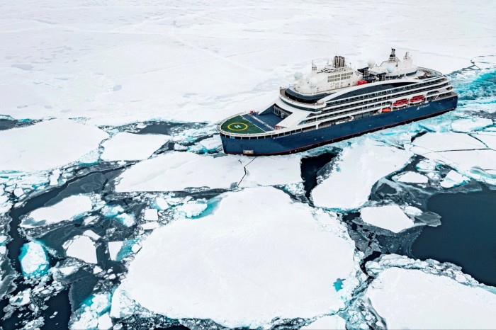 The Le Commandant Charcot cruise ship surrounded by ice