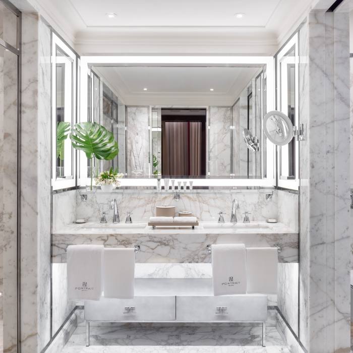 The elegant bathrooms are decked in a mixture of marbles