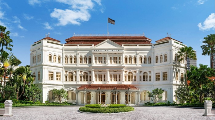 The white stucco façade of Raffles hotel in Singapore