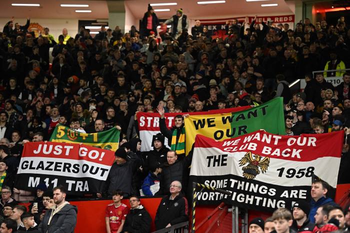 United fans protest against the owners before the English League Cup quarter final match between Manchester United and Charlton Athletic at Old Trafford, in Manchester