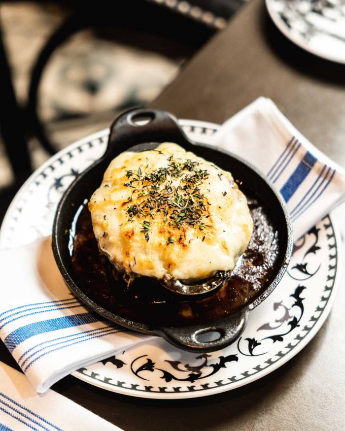A bowl of French onion soup at Cluny Bistro & Boulangerie