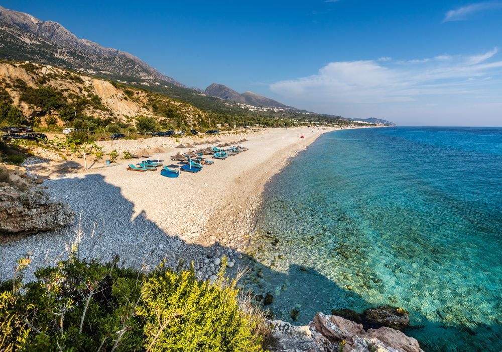 beach at the seaside town of Vlore in Albania with sand and clear water
