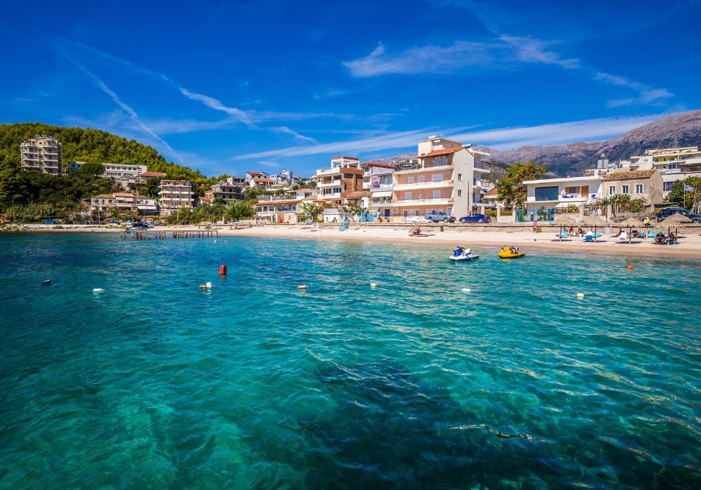 best places to visit in albania saranda. seaside homes and clear water
