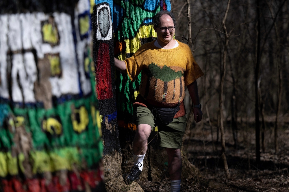 Sam Barsky poses at the Oregon Ridge Park which is depicted on his sweater in Cockeysville, Maryland March 8, 2023. — AFP pic
