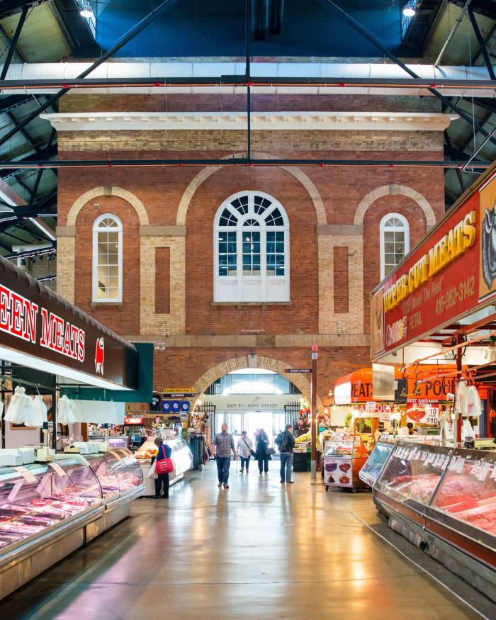 A long corridor flanked by butchers’ stalls in St Lawrence Market 