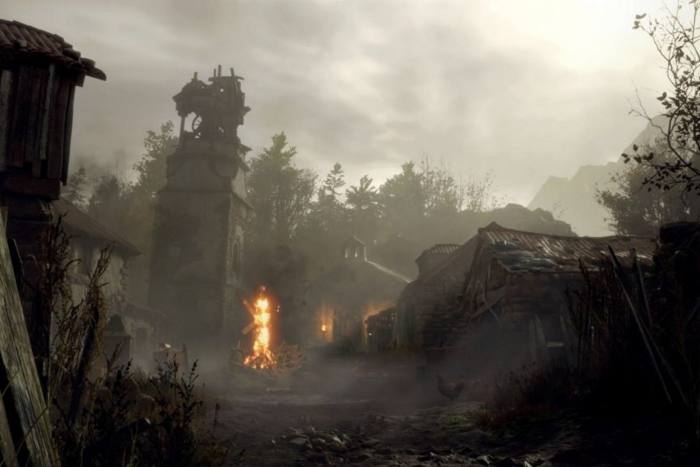 An image from a video game shows a burning building in a rural setting
