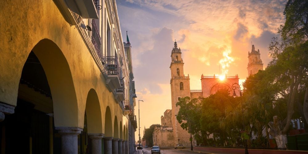 The sun setting behind the zocalo in central Merida